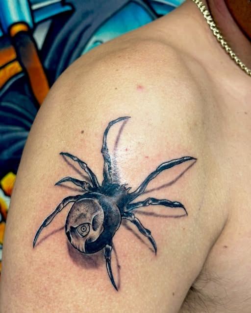 Realistic 3D spider tattoo on the shoulder