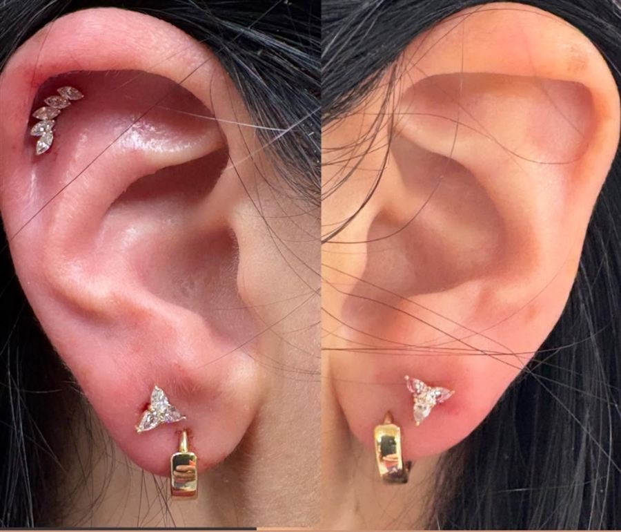 Matching ear lobe piercings with jeweled huggie earrings