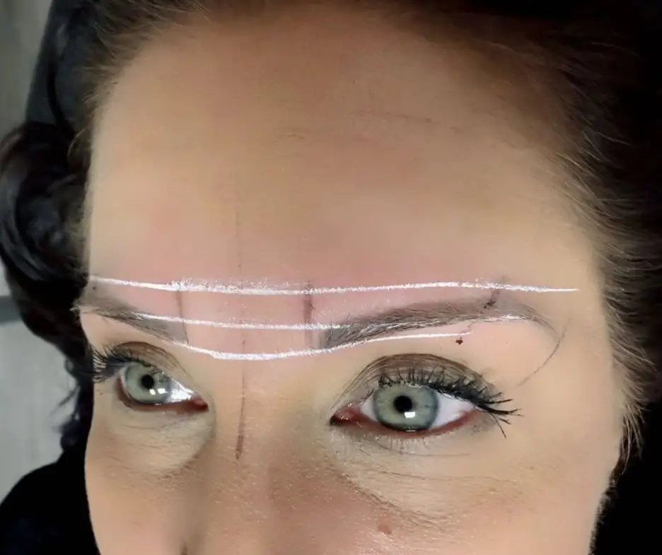 Eyebrow mapping with measured guide lines before permanent makeup